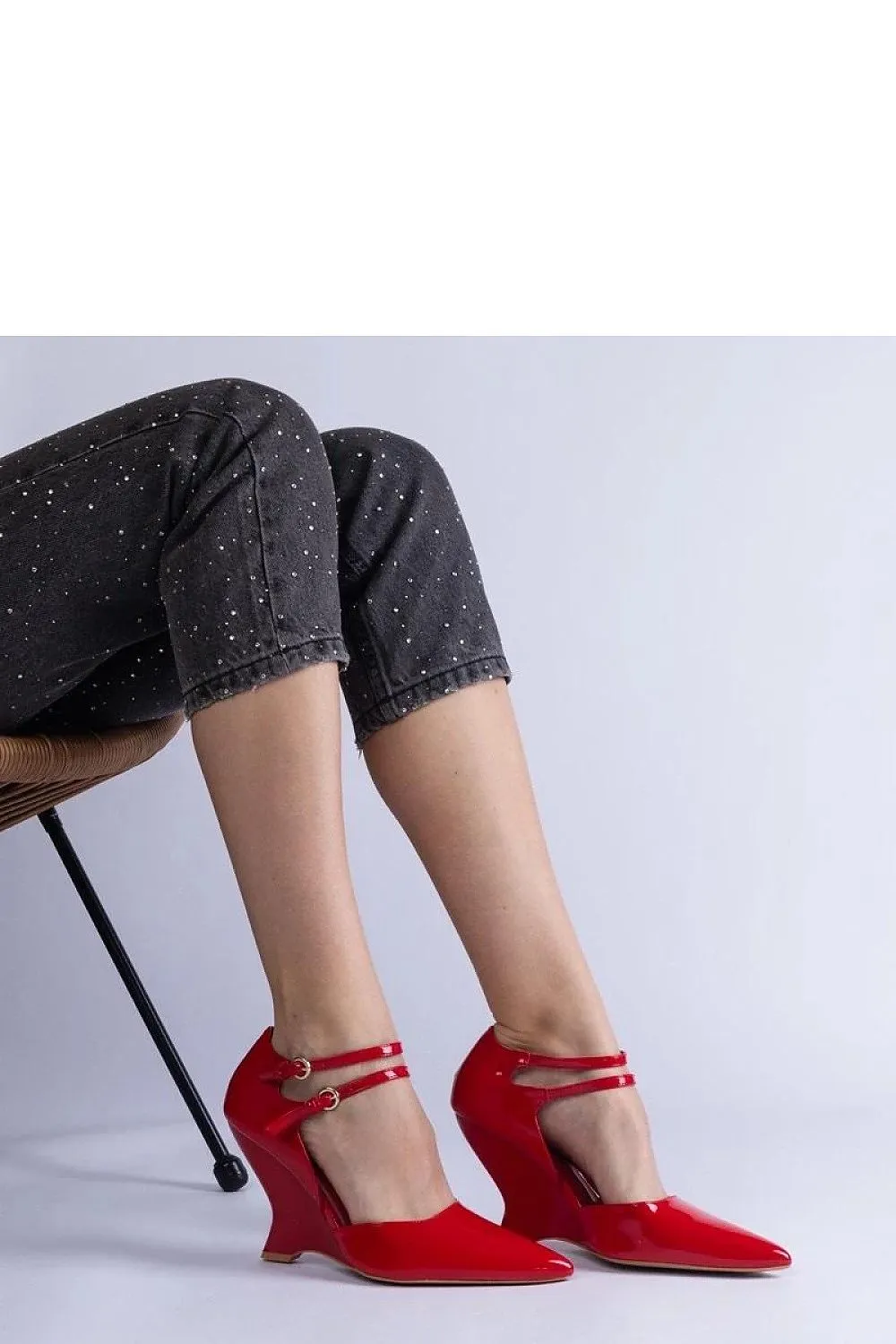 Black patent leather wedge pumps with Vizario buckles