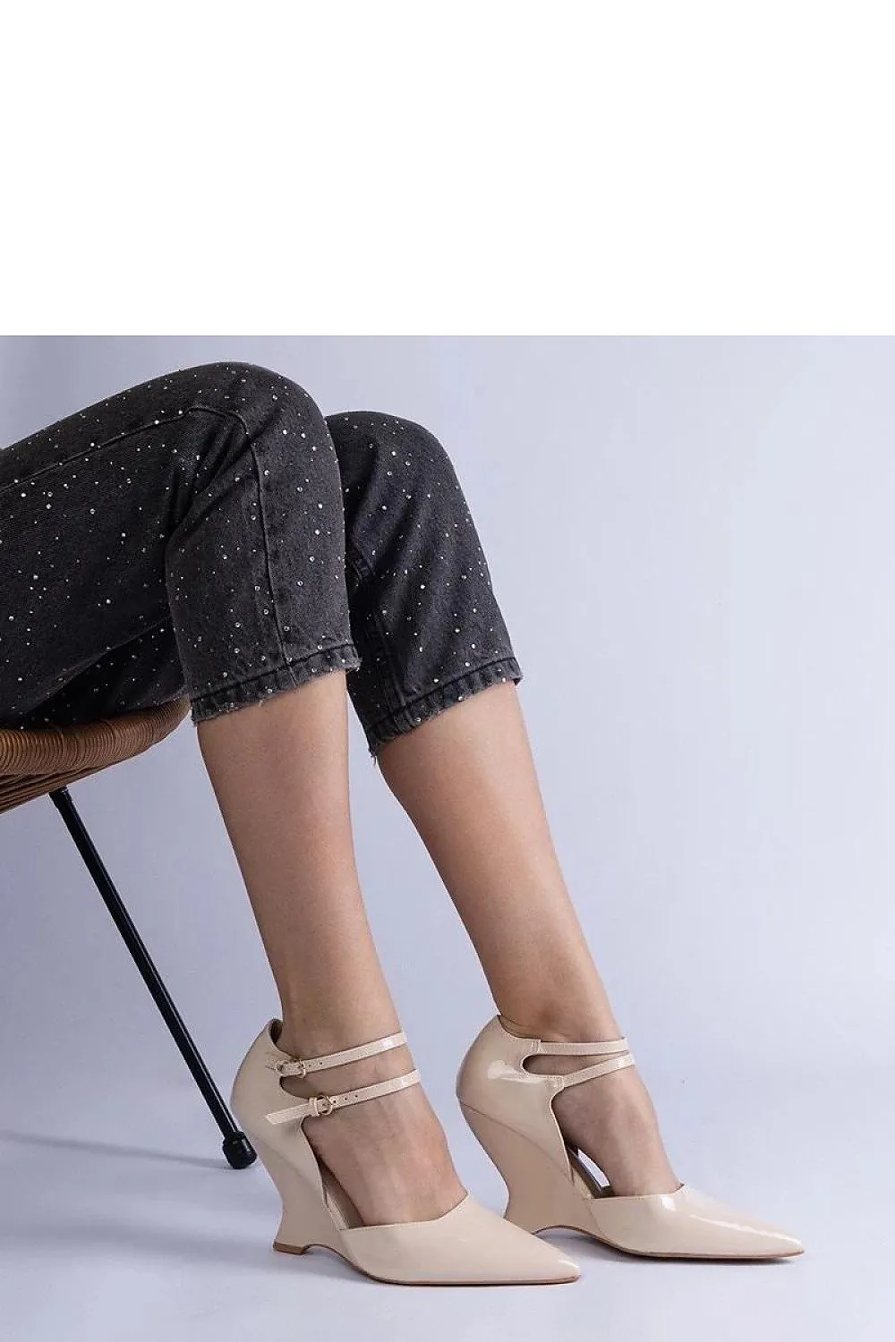 Black patent leather wedge pumps with Vizario buckles