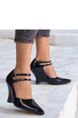 Black patent leather wedge pumps with Vizario buckles