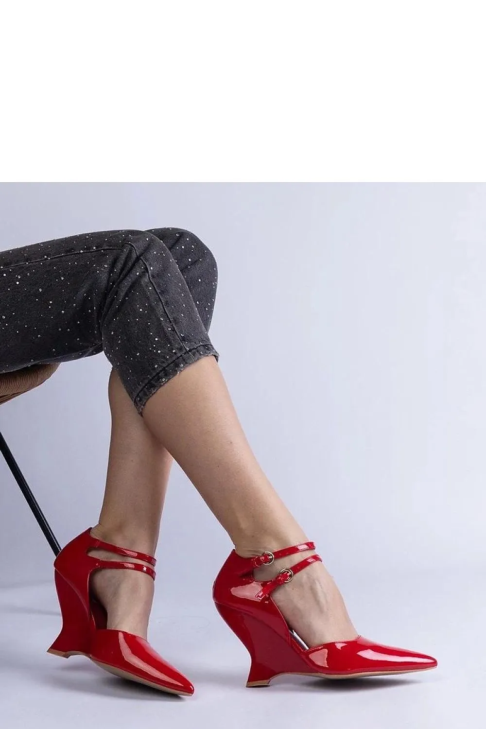 Black patent leather wedge pumps with Vizario buckles