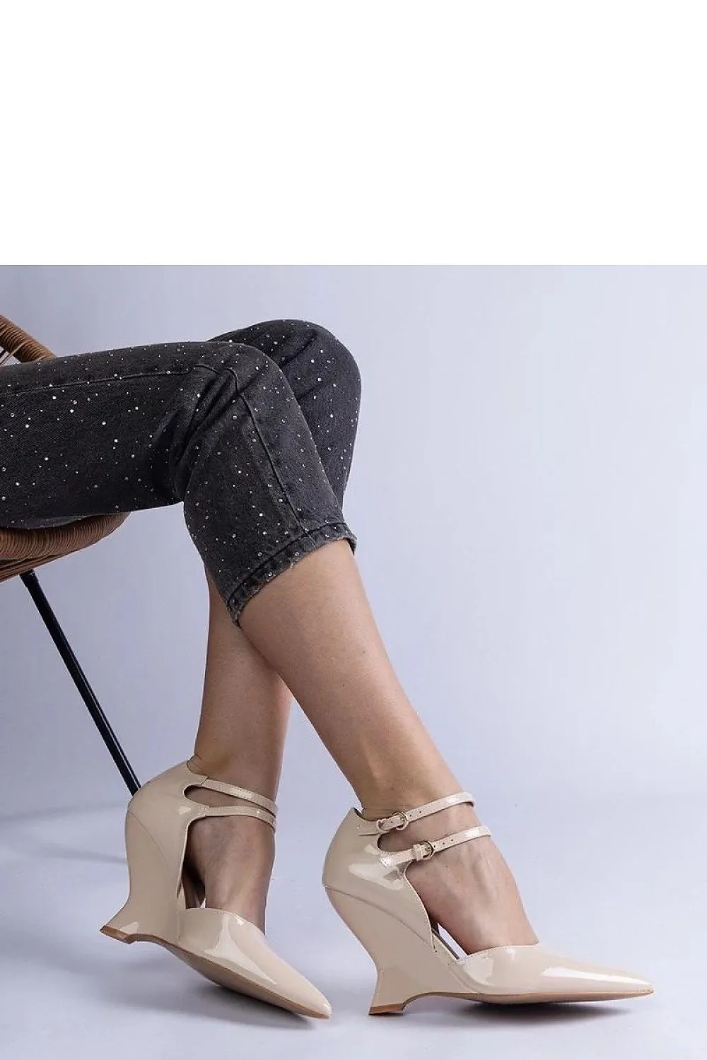 Black patent leather wedge pumps with Vizario buckles